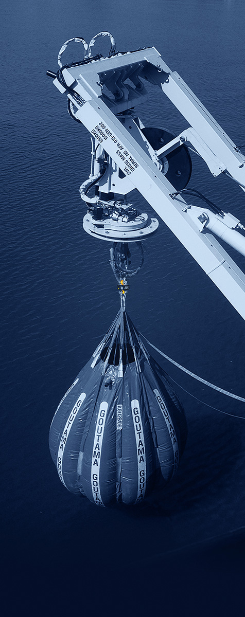 A water bag is lifted by a crane for proof load
